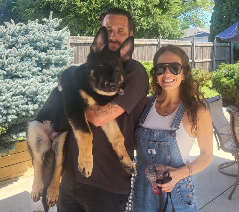 family protection puppy with couple