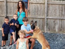 family protection dog with family at park