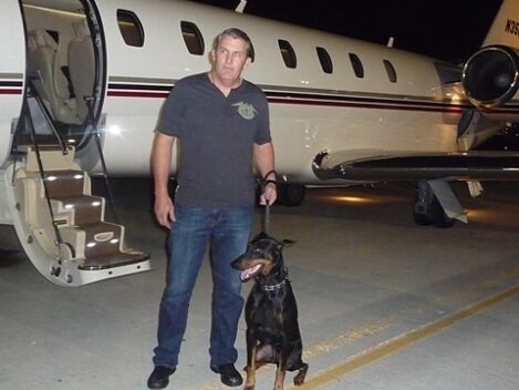 family estate protection dog with man and plane
